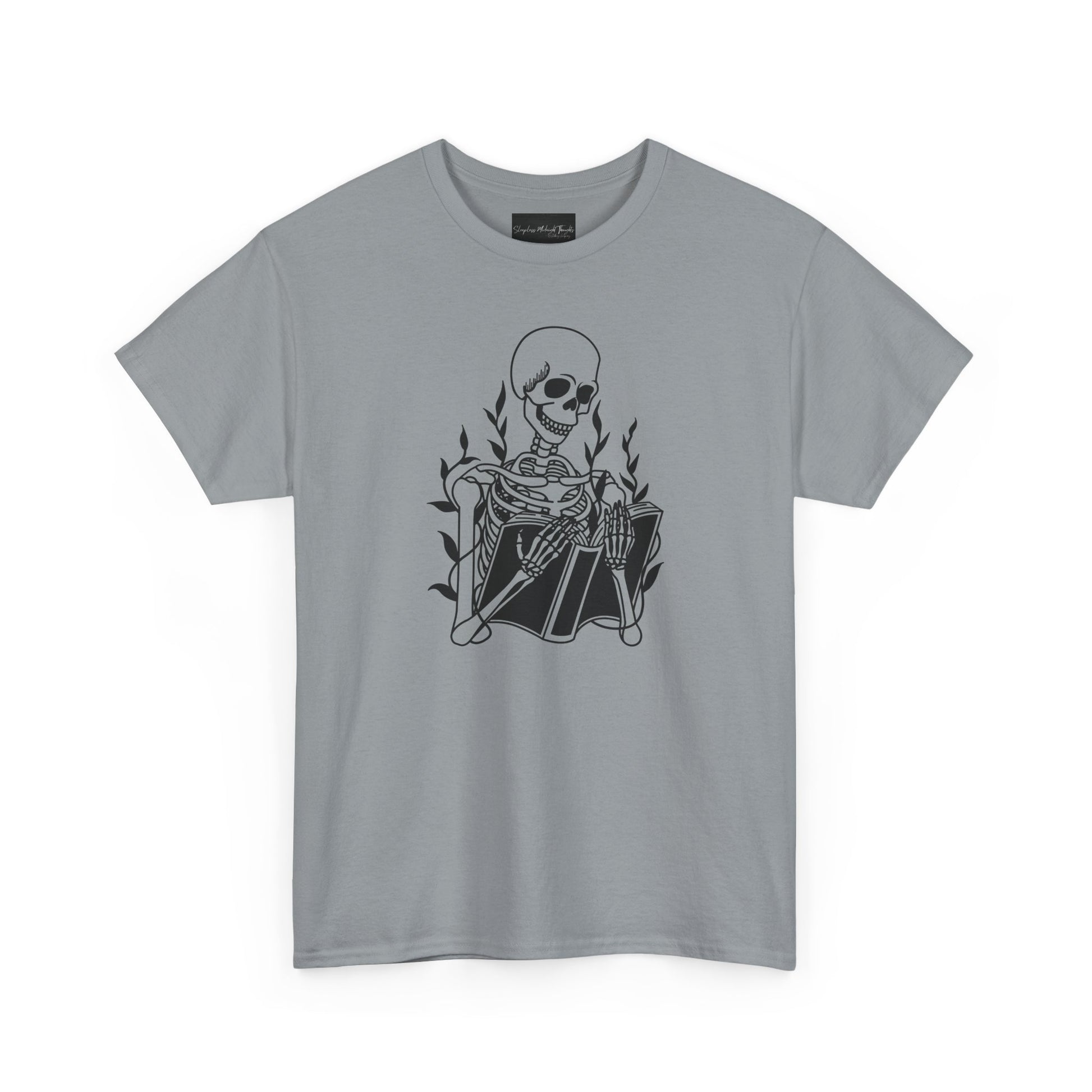 On the front of this custom unisex short sleeve shirt is a large image of a skeleton reading a book, there are vines with leaves on them behind the skeleton.
