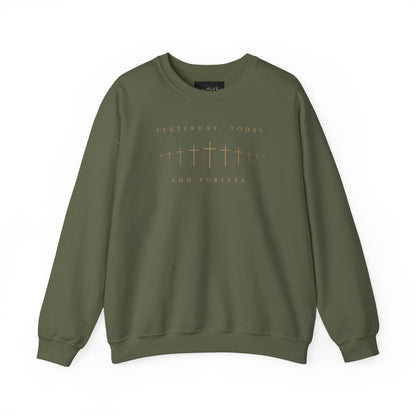 On the front of this Christian pullover sweatshirt is a row of Jesus crosses that look like they are fading into the distance, the words Yesterday, Today and Forever are on the top and the bottom of the crosses.