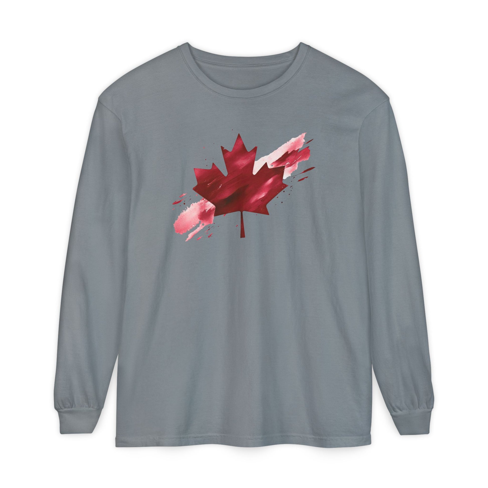 On the front of this unisex long sleeve shirt is an image of a Canadian maple leaf that is bright red, it looks like it has been spray painted onto the front of the shirt.