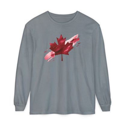 On the front of this unisex long sleeve shirt is an image of a Canadian maple leaf that is bright red, it looks like it has been spray painted onto the front of the shirt.