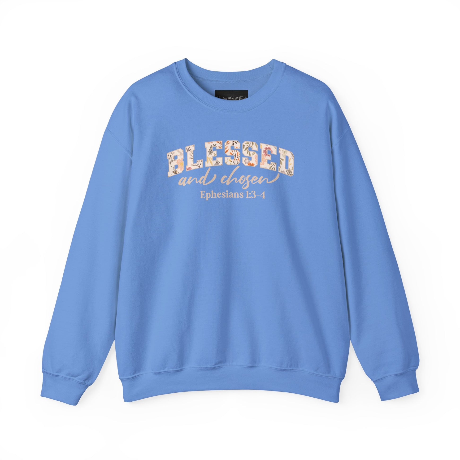 On the front of this custom Christian sweatshirt is the bible verse Blessed and Chosen Ephesians 1:3-4 with the word Blessed being in large bubble letters with a floral pattern on the inside of the letters.