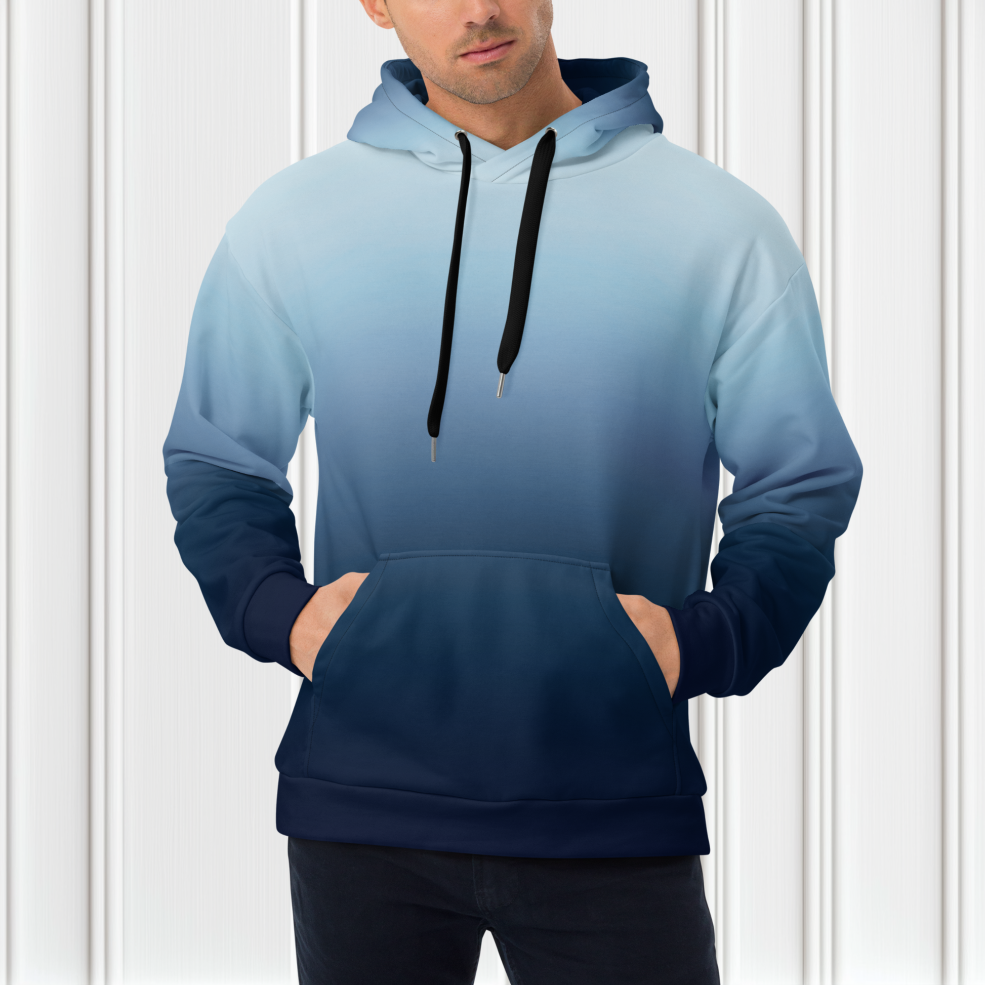 A custom handmade unisex pullover hooded sweatshirt with an ombre design with the top of the hoodie being a very light blue color then it slowly shifting to a navy blue at the bottom of the hoodie.