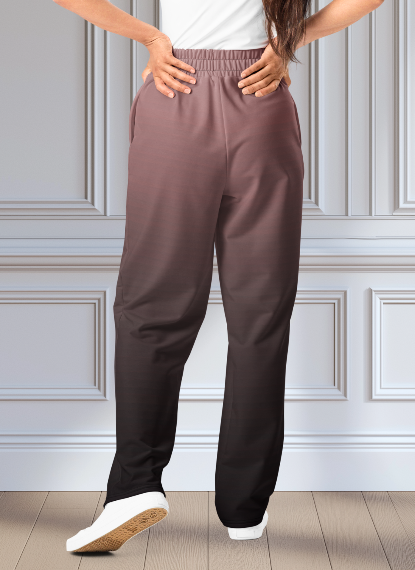 The super soft pair of wide leg unisex joggers that have a ombre pattern starting as a light mauve color on the top of the sweats and fading to a black color at the bottom of the sweats.