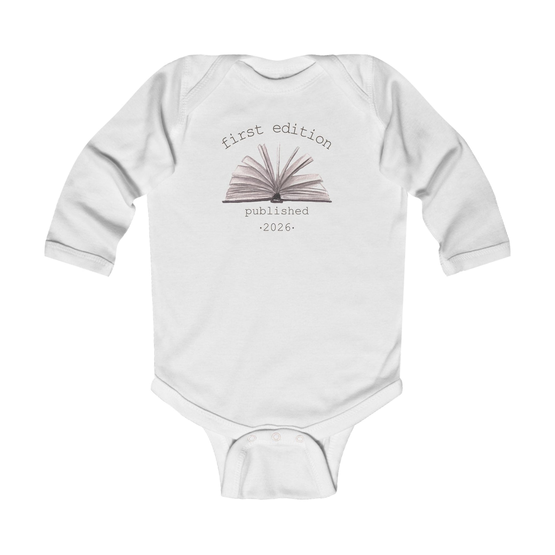 On the front of this custom baby onesie are the words First Edition Published 2026 with an image of an open book in the middle of the wording.