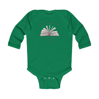 On the front of this custom baby onesie are the words First Edition Published 2026 with an image of an open book in the middle of the wording.