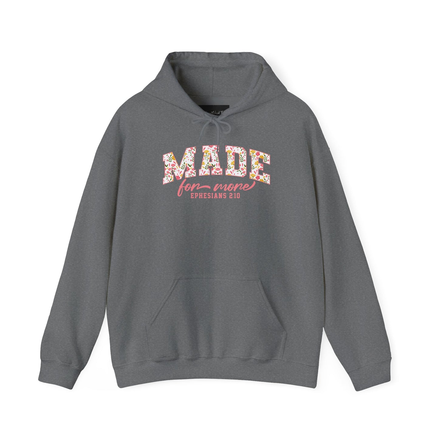 On the front of this custom Christian hoodie is the bible verse the says Made for more Ephesians 2:10, with the word "Made" being large block letters with a pink floral pattern inside the letters, all the other words are in a light pink color.