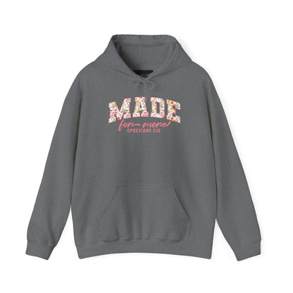 On the front of this custom Christian hoodie is the bible verse the says Made for more Ephesians 2:10, with the word "Made" being large block letters with a pink floral pattern inside the letters, all the other words are in a light pink color.