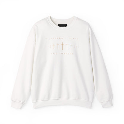 On the front of this Christian pullover sweatshirt is a row of Jesus crosses that look like they are fading into the distance, the words Yesterday, Today and Forever are on the top and the bottom of the crosses.