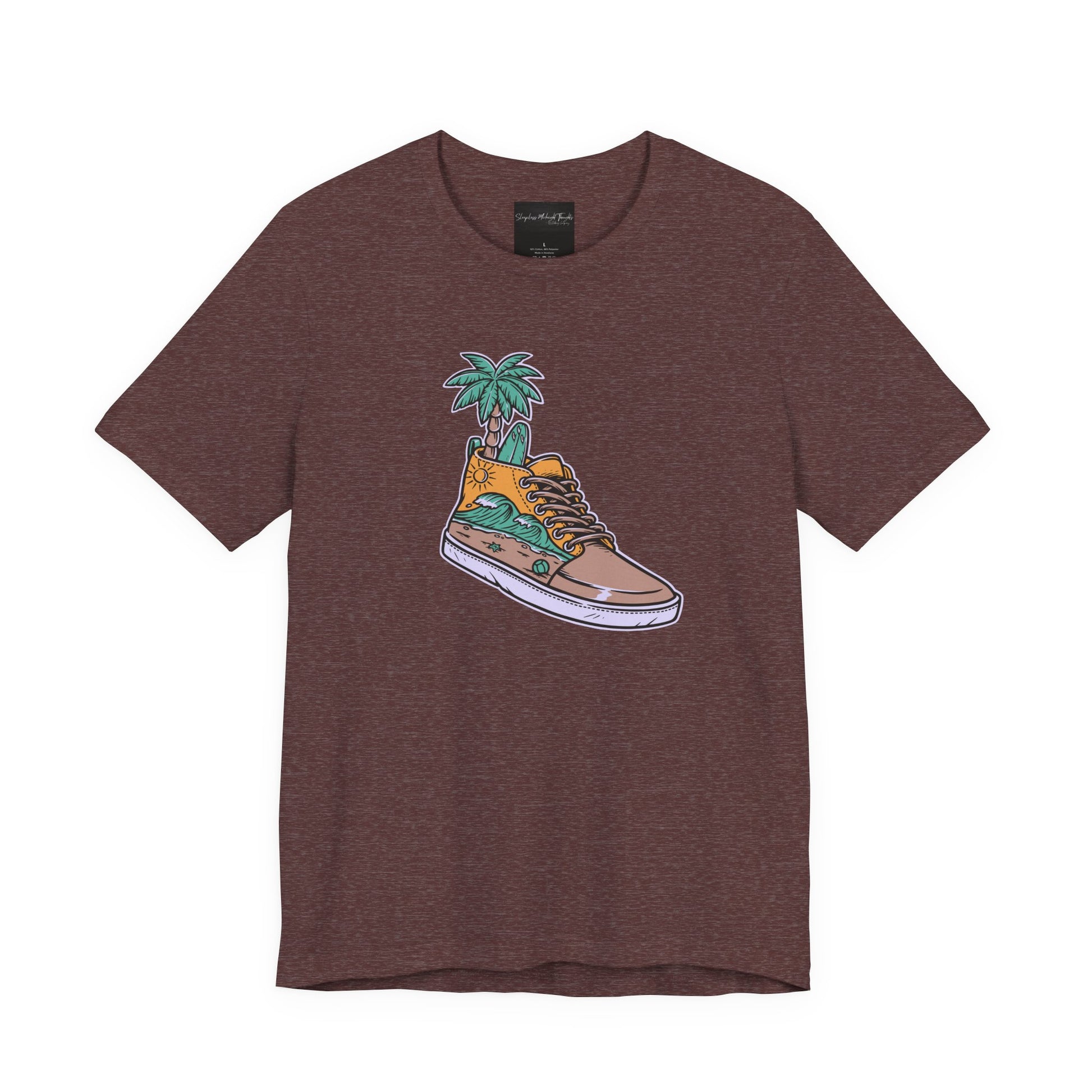 On the front of this custom handmade short sleeve shirt is an image of a high top running shoe with ocean waves running along the side of the shoe, coming out of the top of the shoe where your foot goes is a palm tree and a surf board.