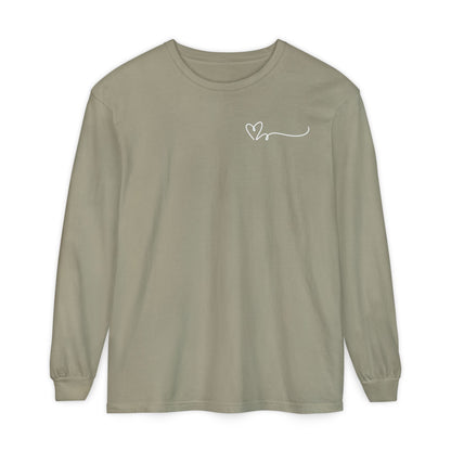 On the top right chest of this custom long sleeve t-shirt is a heart with a trail behind it signifying a heartbeat that you would see on a heart monitor. Perfect for health care workers and teachers.