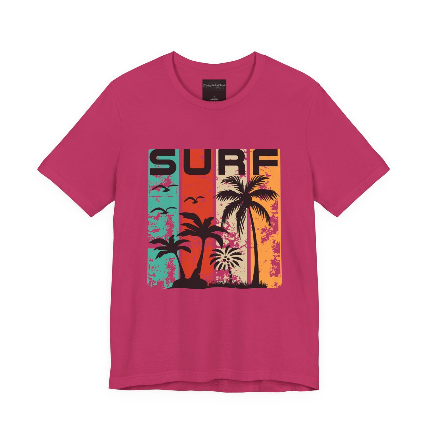 On the front of this custom vacation shirt is the word SURF in large letters at the top of the shirt, each letter has a different colored line through it to the bottom, there are images of palm trees and birds flying underneath the word.