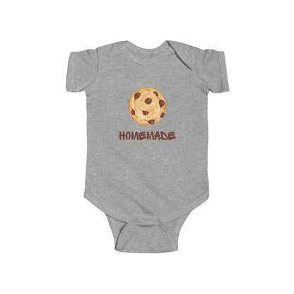 This adorable custom super soft baby onesie that features an image of a chocolate chip cookie in the middle with the word 'homemade' in brown writing underneath the image.