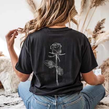 On the back of this custom women's short sleeve shirt is a large rose from the top to the bottom in the center of the back.