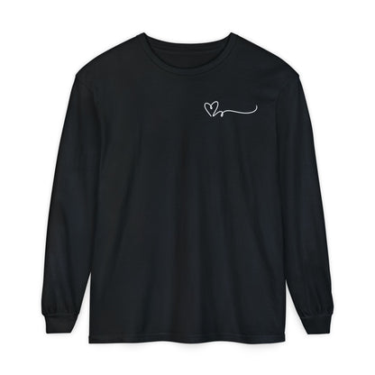 On the top right chest of this custom long sleeve t-shirt is a heart with a trail behind it signifying a heartbeat that you would see on a heart monitor. Perfect for health care workers and teachers.