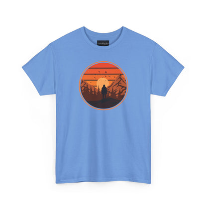 On the front of this custom tee is a large circle on the center of the chest that has an image of bigfoot right in the middle, there is a sun setting with mountain ranges and pine trees in the background.