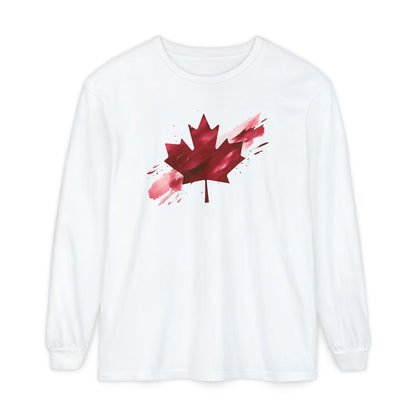 On the front of this unisex long sleeve shirt is an image of a Canadian maple leaf that is bright red, it looks like it has been spray painted onto the front of the shirt.