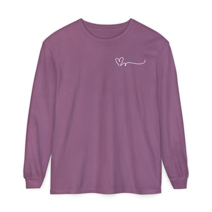 On the top right chest of this custom long sleeve t-shirt is a heart with a trail behind it signifying a heartbeat that you would see on a heart monitor. Perfect for health care workers and teachers.