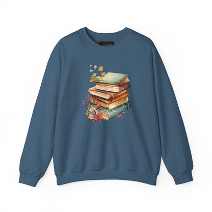 On the front of this custom book lovers sweatshirt is a stack of vintage books with a bunch of wildflowers all around the books.