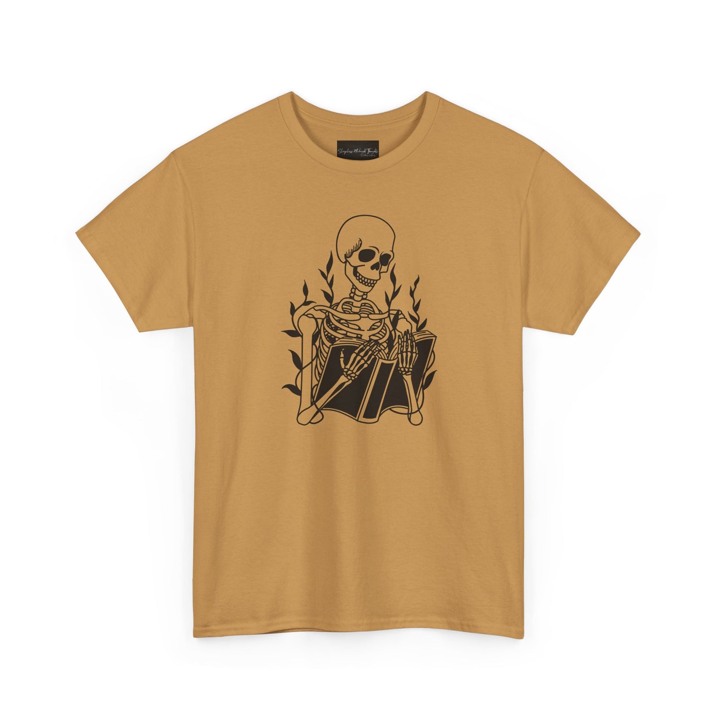 On the front of this custom unisex short sleeve shirt is a large image of a skeleton reading a book, there are vines with leaves on them behind the skeleton.