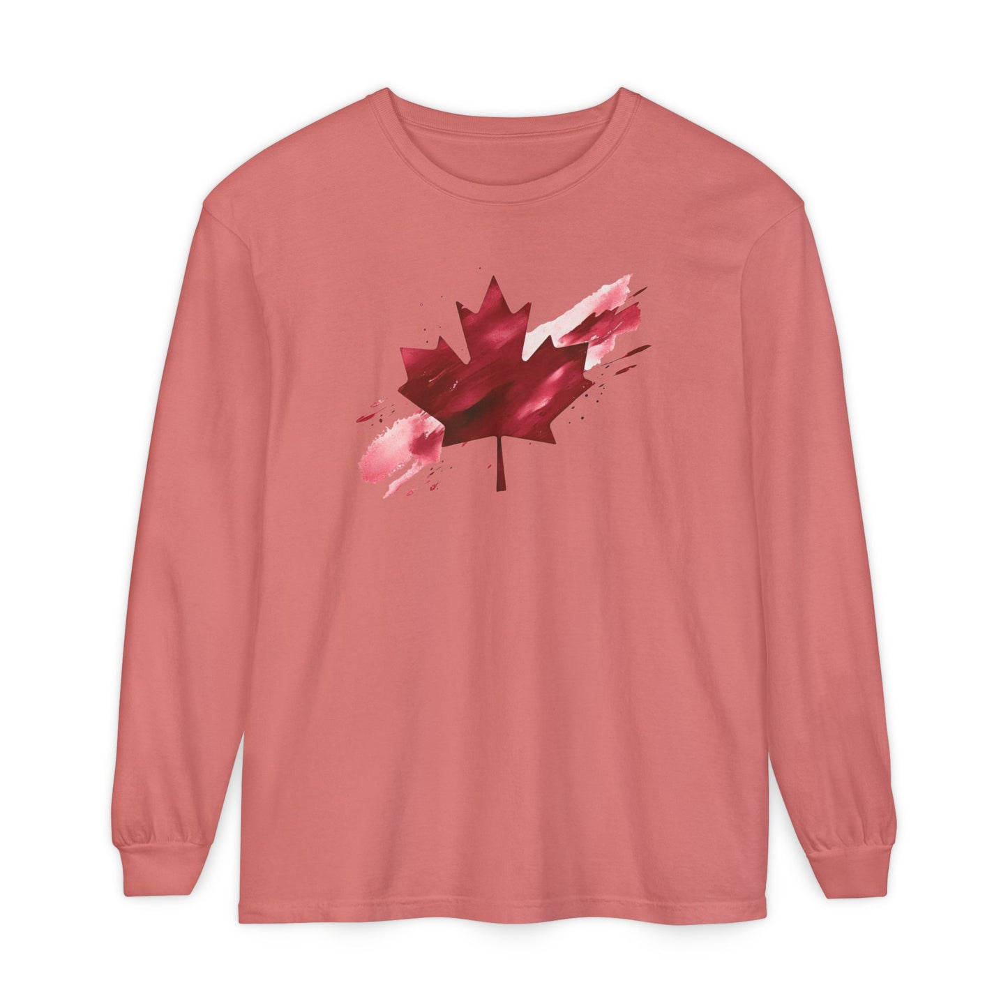 On the front of this unisex long sleeve shirt is an image of a Canadian maple leaf that is bright red, it looks like it has been spray painted onto the front of the shirt.