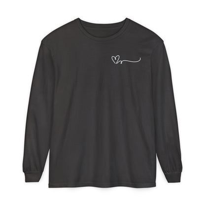 On the top right chest of this custom long sleeve t-shirt is a heart with a trail behind it signifying a heartbeat that you would see on a heart monitor. Perfect for health care workers and teachers.