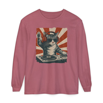 On the front of this custom retro long sleeve shirt is a DJ playing music, except the DJ is a cat that is wearing headphones, there is a vintage red and ivory background behind the cat.