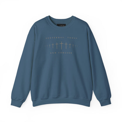 On the front of this Christian pullover sweatshirt is a row of Jesus crosses that look like they are fading into the distance, the words Yesterday, Today and Forever are on the top and the bottom of the crosses.