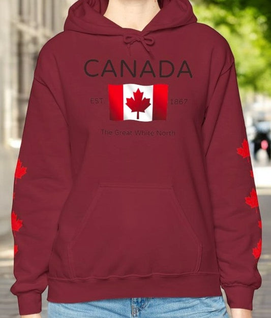 On the front of this custom unisex patriotic sweater is a Canadian flag that looks like it is flying in the wind, the words Canada The Great White North are underneath the flag with the word Est on the right side of the flag with the number 1867 being on the left side of the flag. Each are has red maple leaves that run down each sleeve to the cuff.