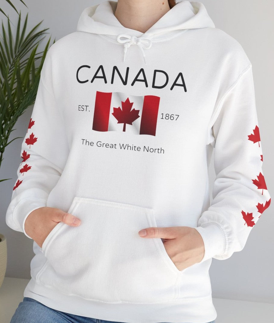 On the front of this custom unisex patriotic sweater is a Canadian flag that looks like it is flying in the wind, the words Canada The Great White North are underneath the flag with the word Est on the right side of the flag with the number 1867 being on the left side of the flag. Each are has red maple leaves that run down each sleeve to the cuff.