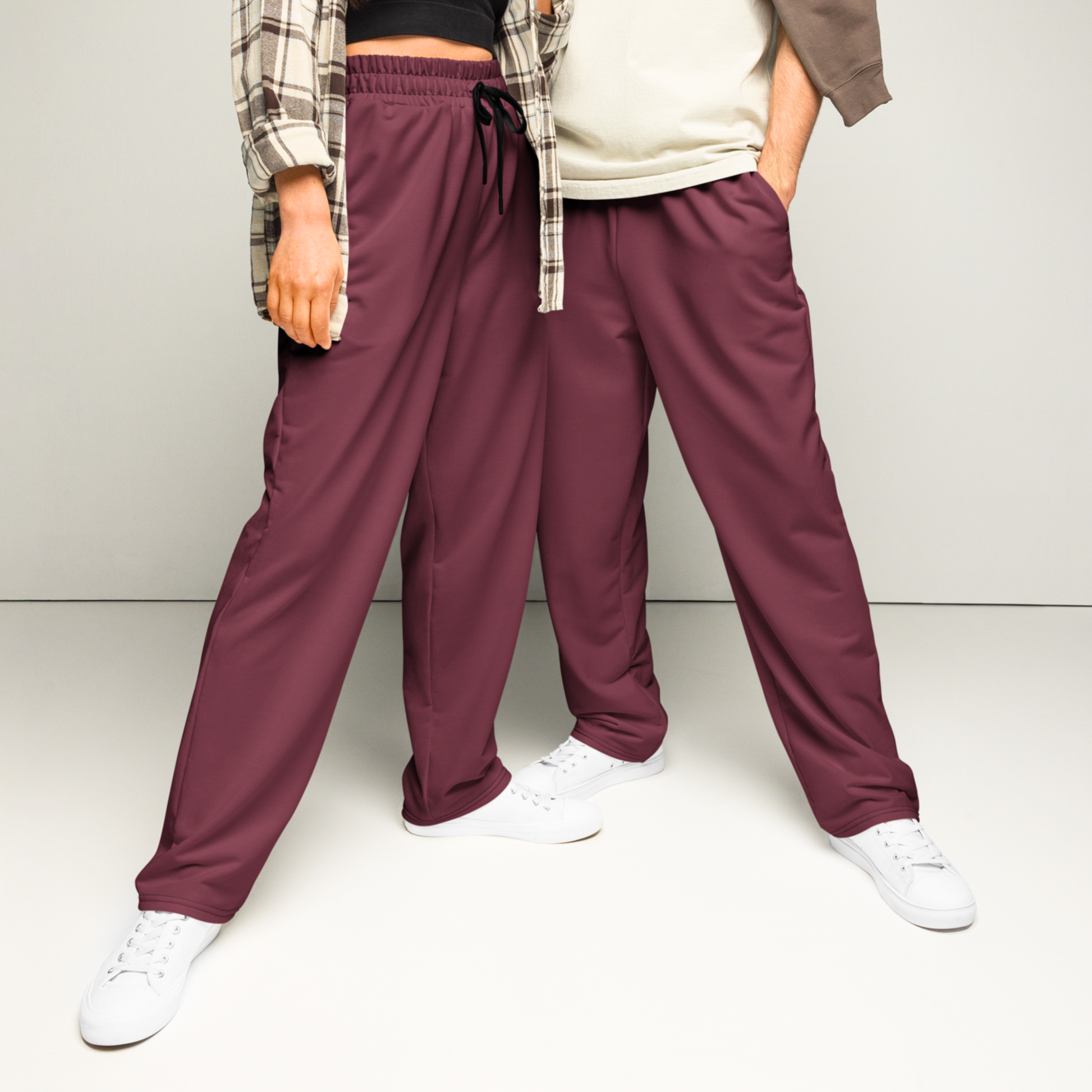 These wide legged joggers are all a deep maroon in color from top to bottom with black strings around the waistband.