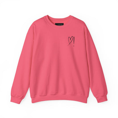 A handmade unisex oversized pullover sweatshirt with a crewneck, on the front left chest of the sweater in white is a heart with an exclamation point on the left hand side if the heart