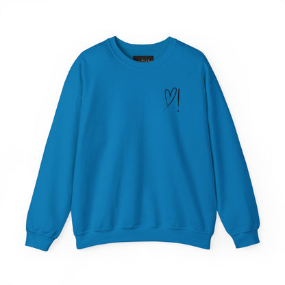 A handmade unisex oversized pullover sweatshirt with a crewneck, on the front left chest of the sweater in white is a heart with an exclamation point on the left hand side if the heart