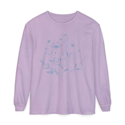 On the front of this custom women's long sleeve t-shirt is a image of a bunch of wildflowers and leaves coming from the bottom of the shirt to the very top, the flowers and leaves are in a light blue color.