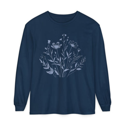 On the front of this custom women's long sleeve t-shirt is a image of a bunch of wildflowers and leaves coming from the bottom of the shirt to the very top, the flowers and leaves are in a light blue color.