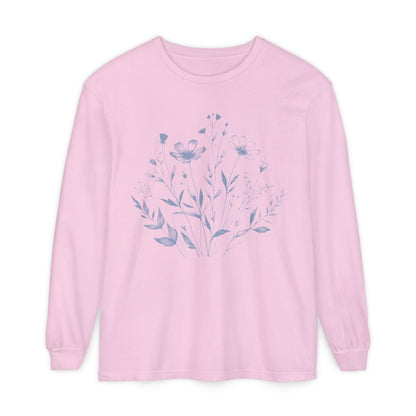 On the front of this custom women's long sleeve t-shirt is a image of a bunch of wildflowers and leaves coming from the bottom of the shirt to the very top, the flowers and leaves are in a light blue color.