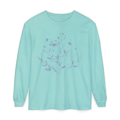 On the front of this custom women's long sleeve t-shirt is a image of a bunch of wildflowers and leaves coming from the bottom of the shirt to the very top, the flowers and leaves are in a light blue color.