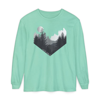 The image on the front of this custom long sleeve shirt is all in black and grey with there being mountains and trees on both sides in the shape on a v making it looking as if you are looking down a valley, the words wild child are in white on the bottom left of the image.