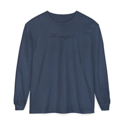 On the front of this custom unisex long sleeve t-shirt is the word thankful in a flowy cursive font.