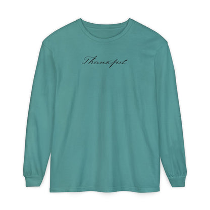 On the front of this custom unisex long sleeve t-shirt is the word thankful in a flowy cursive font.