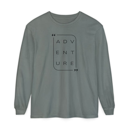 On the front of this super soft unisex long sleeve shirt is the word adventure with there being three letters on each line, it is in a modern font. There is a border around the word.