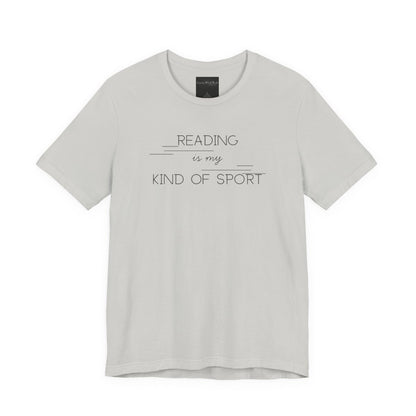 On the front of this custom booklover short sleeve shirt are the words Reading is my Kind of Sport, in a modern font with different length lines on either end of the writing giving the shirt a retro look.
