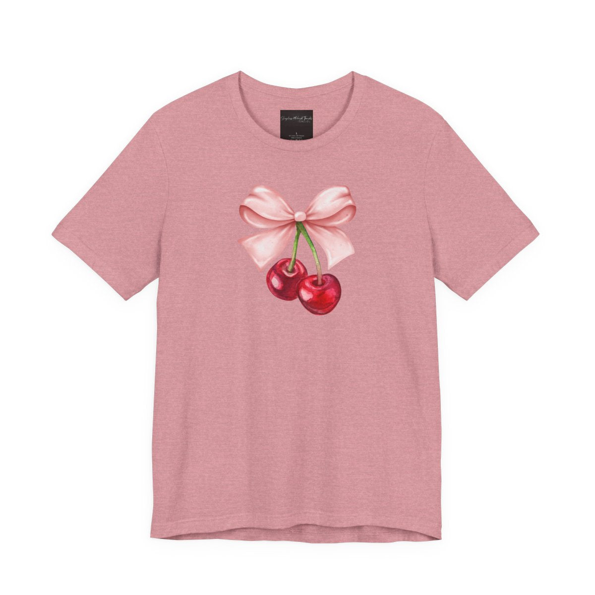 On the front of this custom women's short sleeve shirt is an image of a pair of cherries hanging from a stem with a pink bow on the top of them.