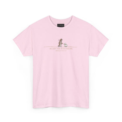 On the front of this custom Christian t-shirt is an image of Jesus the shepherd standing next to a little lamb, underneath the image are the words He left the 99 to Rescue Me Matthew 18:12-14.