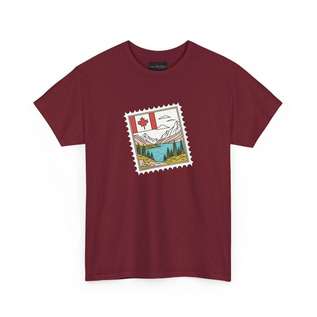 On the front of this custom Canadian pride short sleeve shirt is an image of a Canadian postage stamp with the Canadian flag in one corner and an image of mountains, a lake, and trees the make up the rest of the stamp.