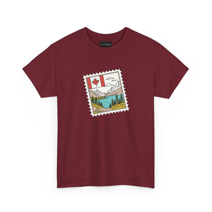 On the front of this custom Canadian pride short sleeve shirt is an image of a Canadian postage stamp with the Canadian flag in one corner and an image of mountains, a lake, and trees the make up the rest of the stamp.