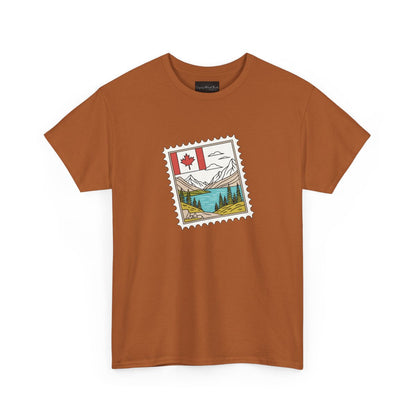 On the front of this custom Canadian pride short sleeve shirt is an image of a Canadian postage stamp with the Canadian flag in one corner and an image of mountains, a lake, and trees the make up the rest of the stamp.