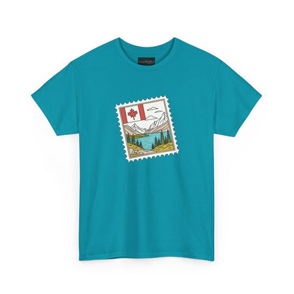 On the front of this custom Canadian pride short sleeve shirt is an image of a Canadian postage stamp with the Canadian flag in one corner and an image of mountains, a lake, and trees the make up the rest of the stamp.