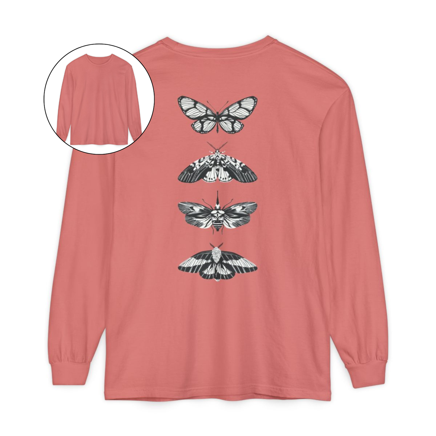 On the back of this long sleeve women's shirt right in between the shoulder blades is a row of black and white butterflies, starting at the top of the back and headed to the bottom of the shirt.