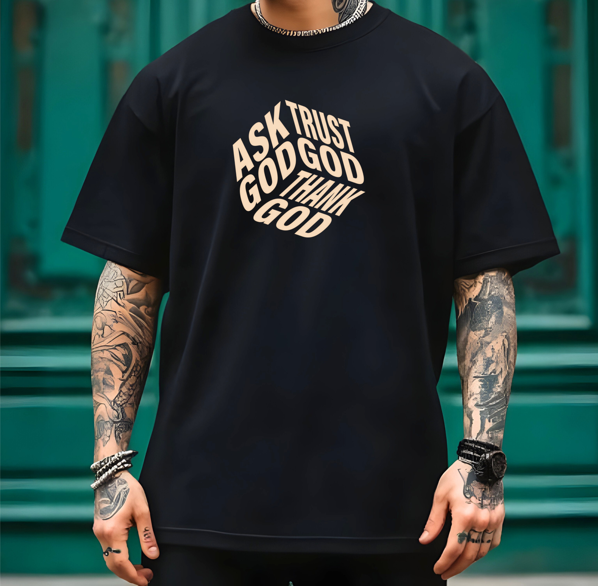 On the front of this custom unisex short sleeve shirt are the words Ask God, Trust God, Thank God, they are in the shape of a 3D cube with each set of words being one side of the cube.