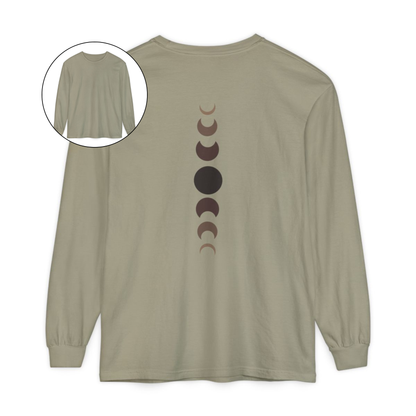 On the back of this custom unisex long sleeve t-shirt from the top of the shirt to the bottom are 7 images of the moon showing the moons cycle, every moon is a different shade of brown.